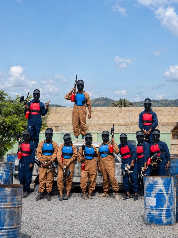 Group of participants geared up for a paintballing match
